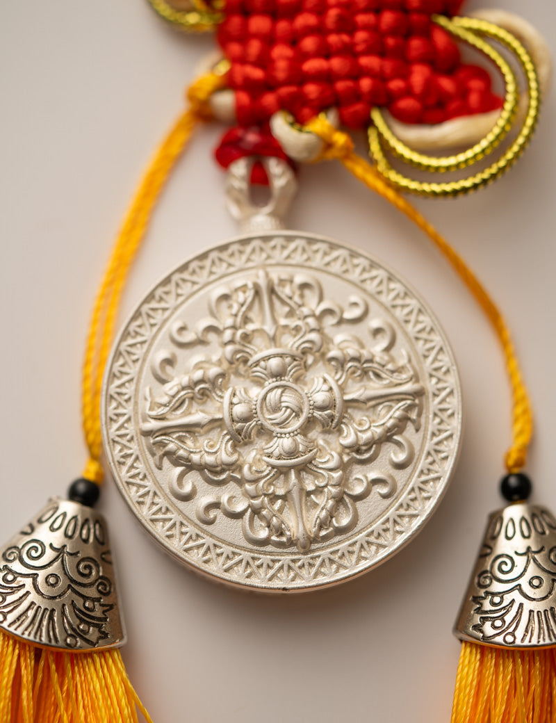 Tassel-Adorned Endless Knot Locket