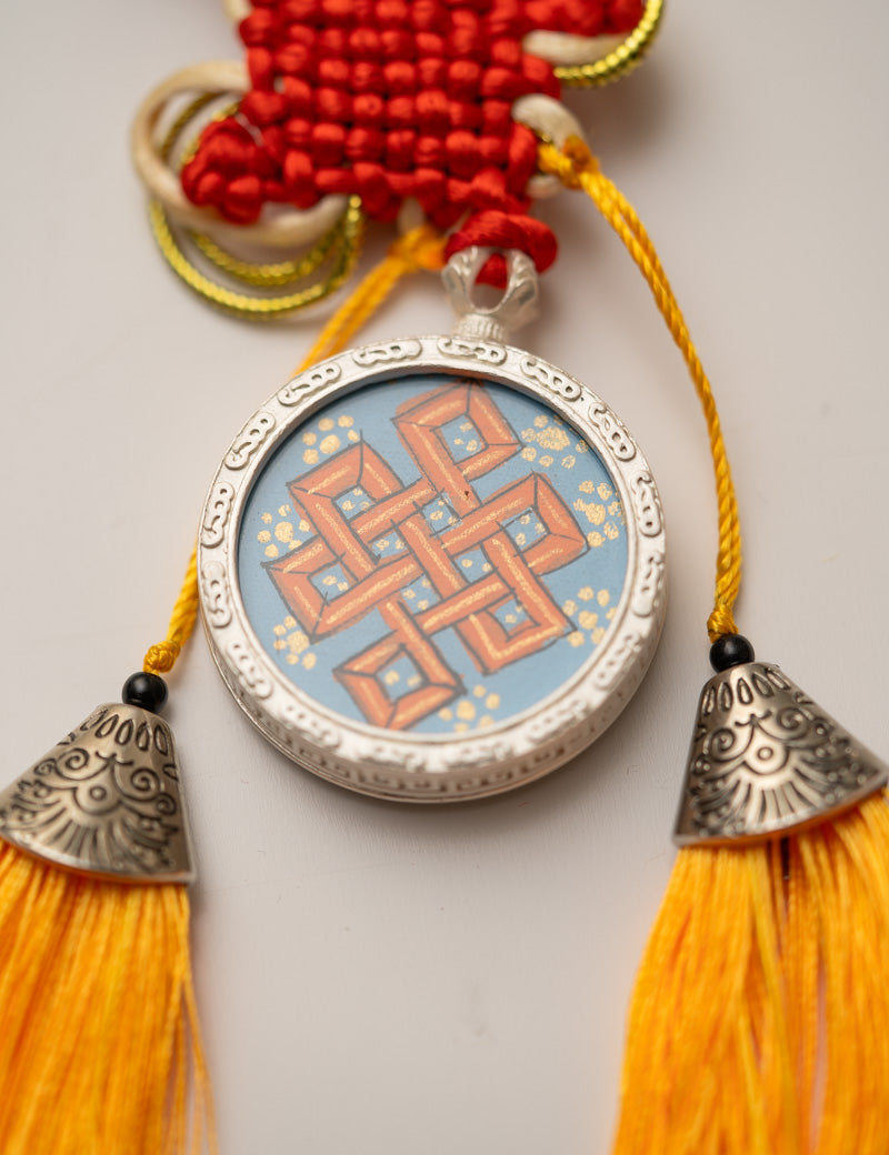 Tassel-Adorned Endless Knot Locket