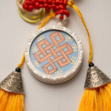 Tassel-Adorned Endless Knot Locket