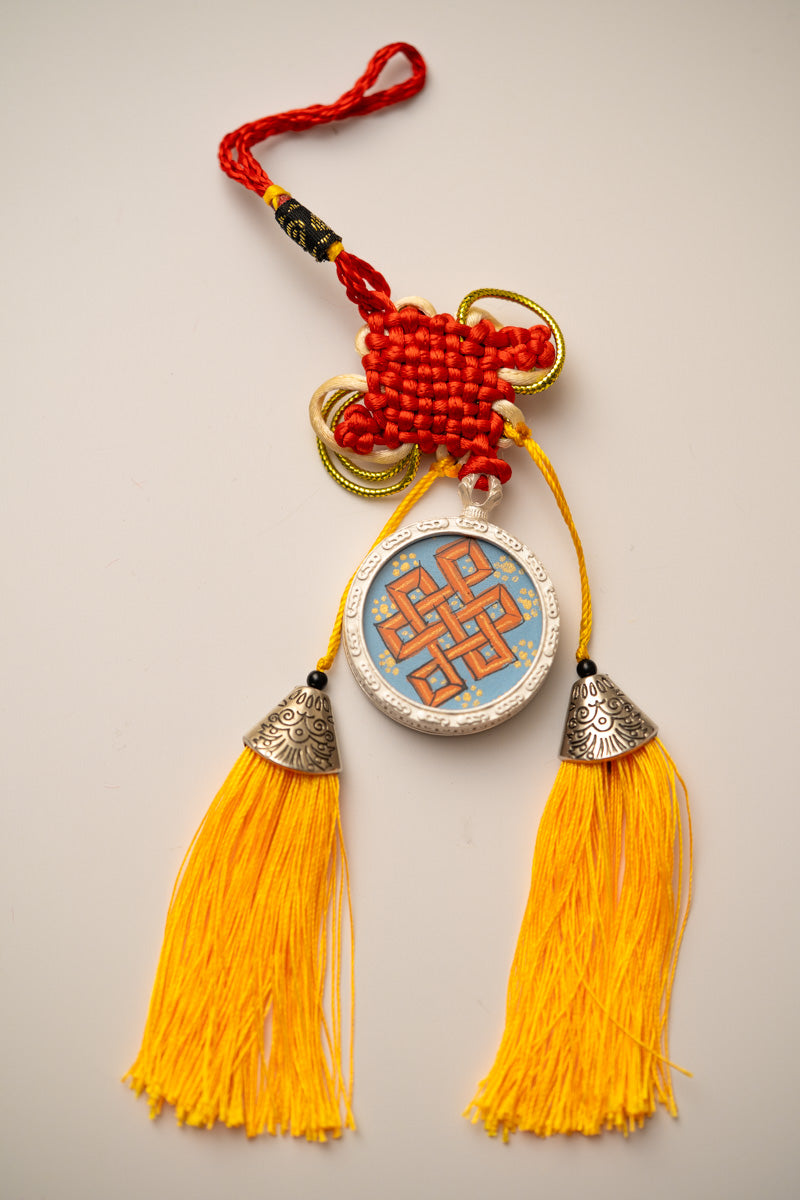 Tassel-Adorned Endless Knot Locket