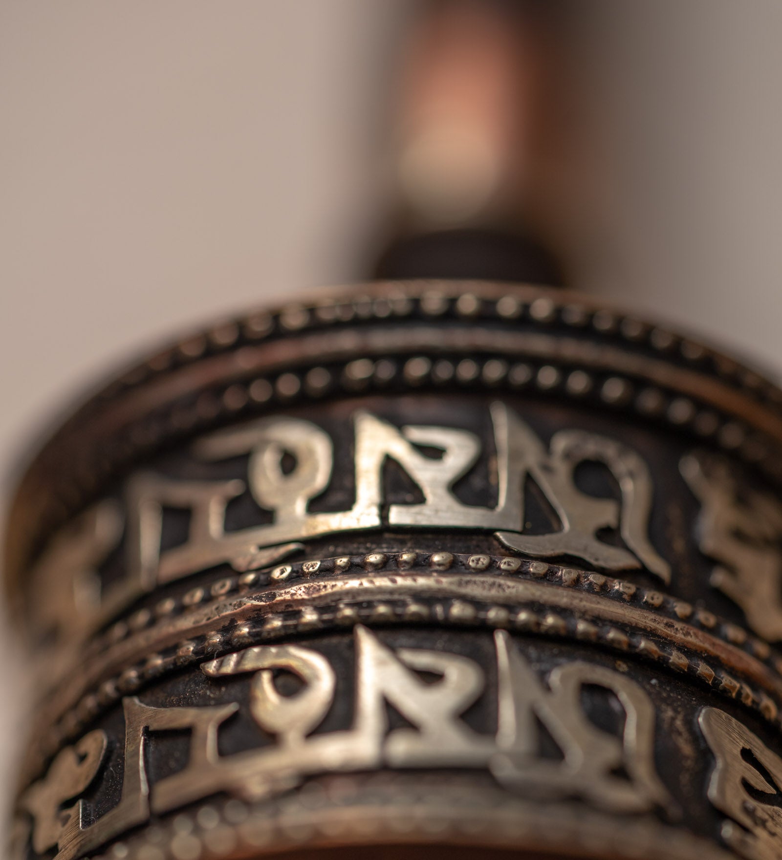 Wood handle prayer wheel for spiritual and religious routines.