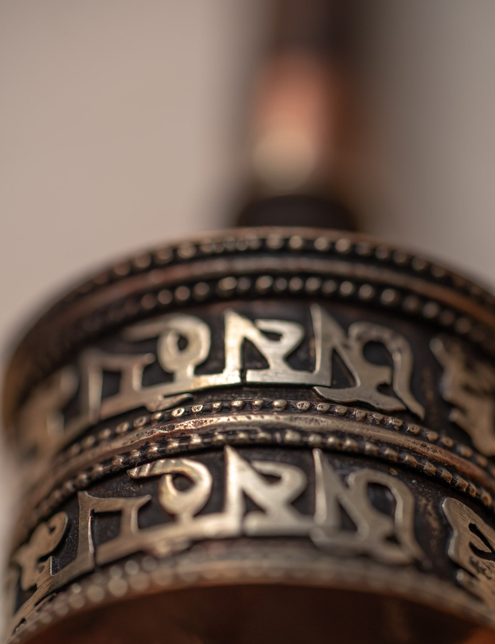 Wood handle prayer wheel for spiritual and religious routines.