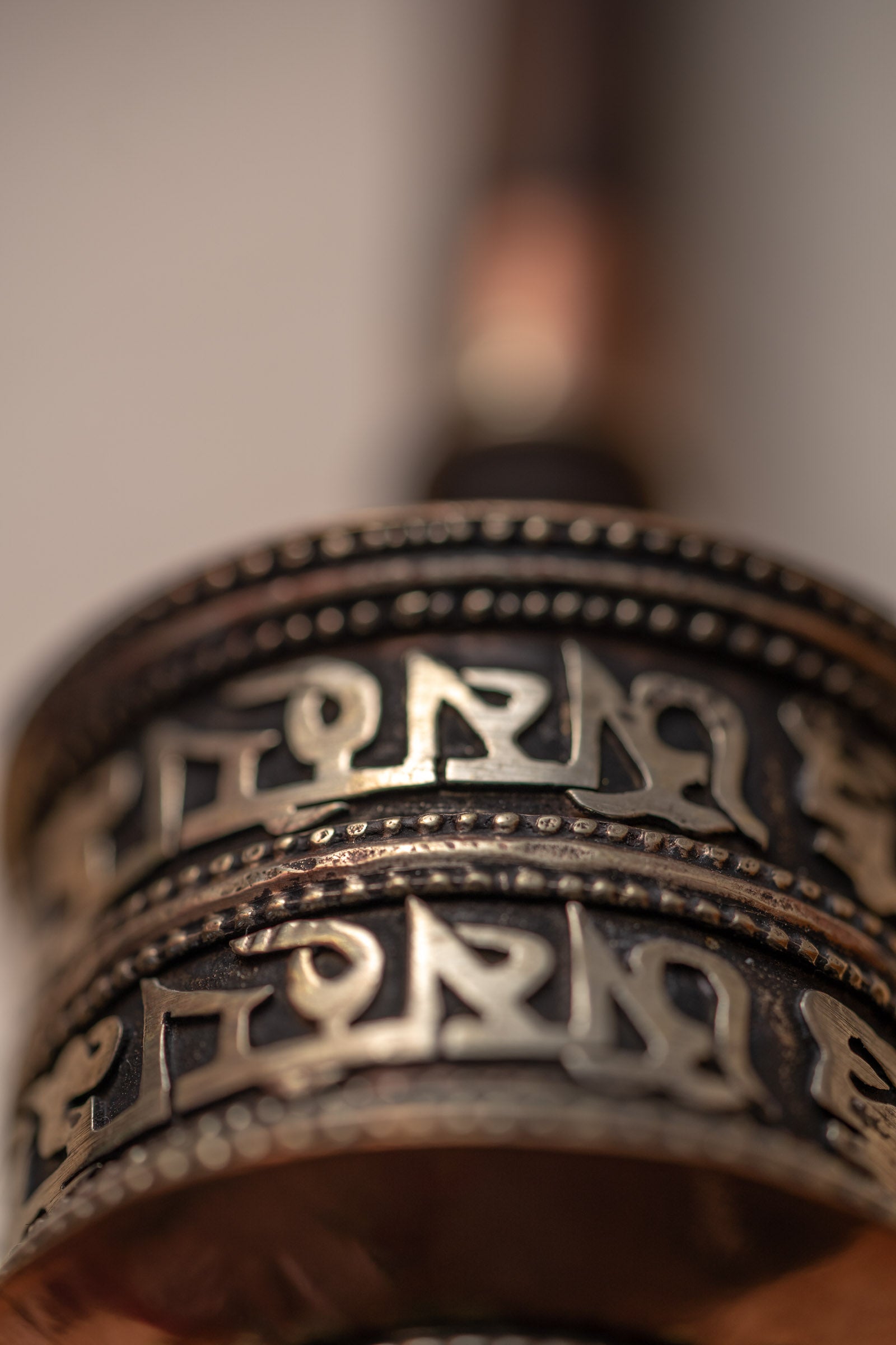 Wood handle prayer wheel for spiritual and religious routines.