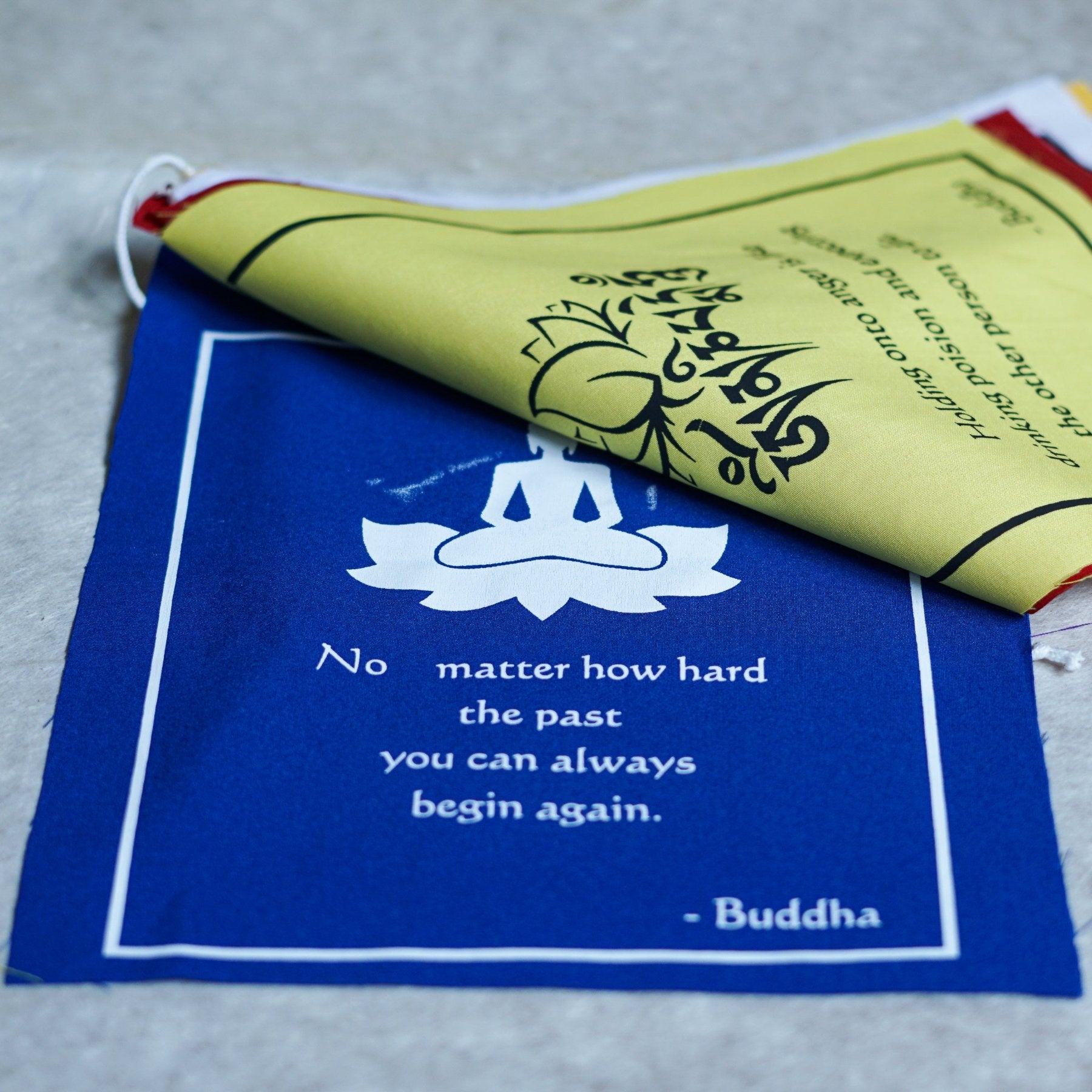 Buddha quote-adorned prayer flag