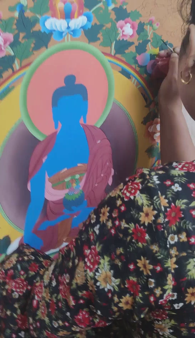 Thangka artist painting medicine buddha