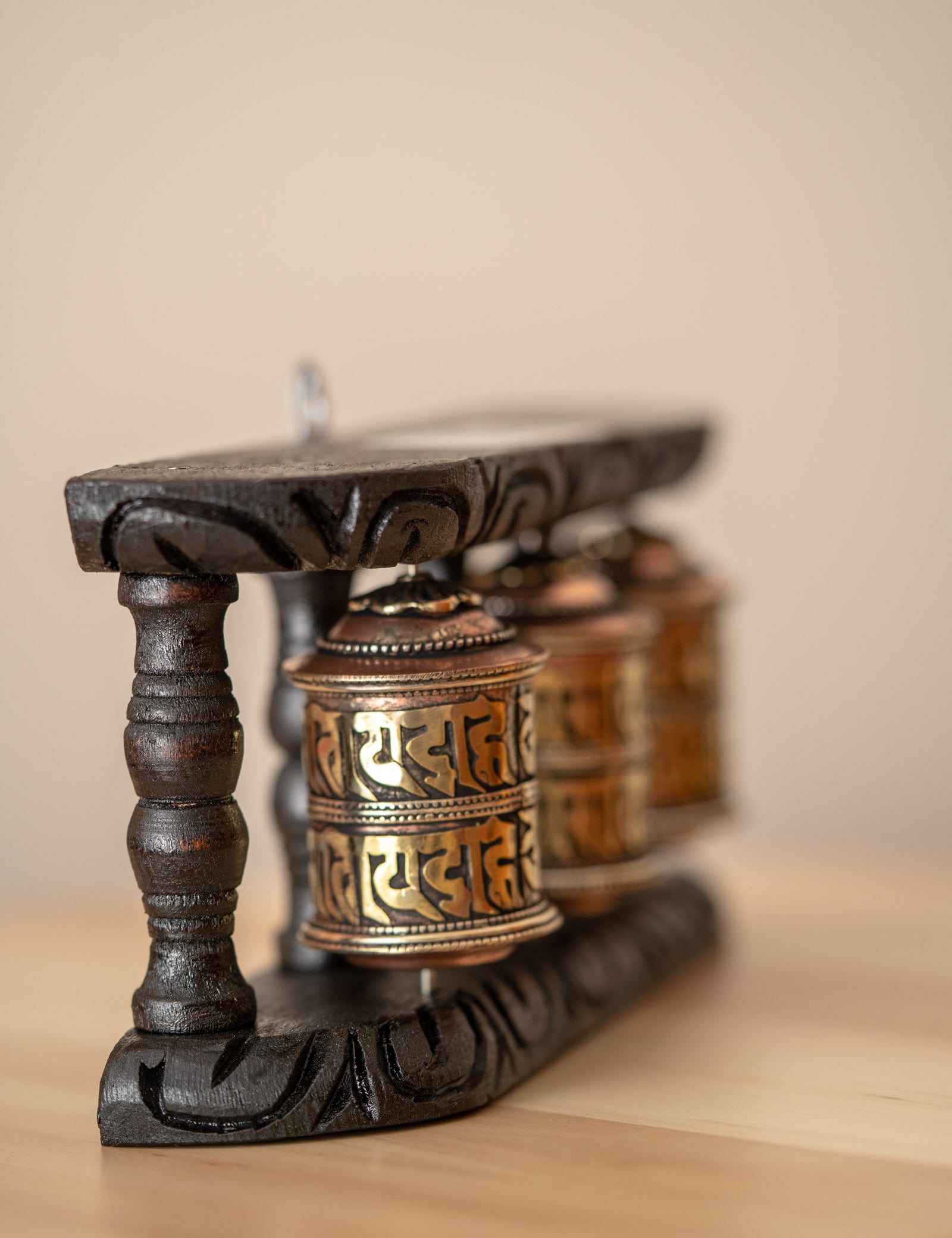 Wood Stand Prayer Wheel for home decor and spirituality.