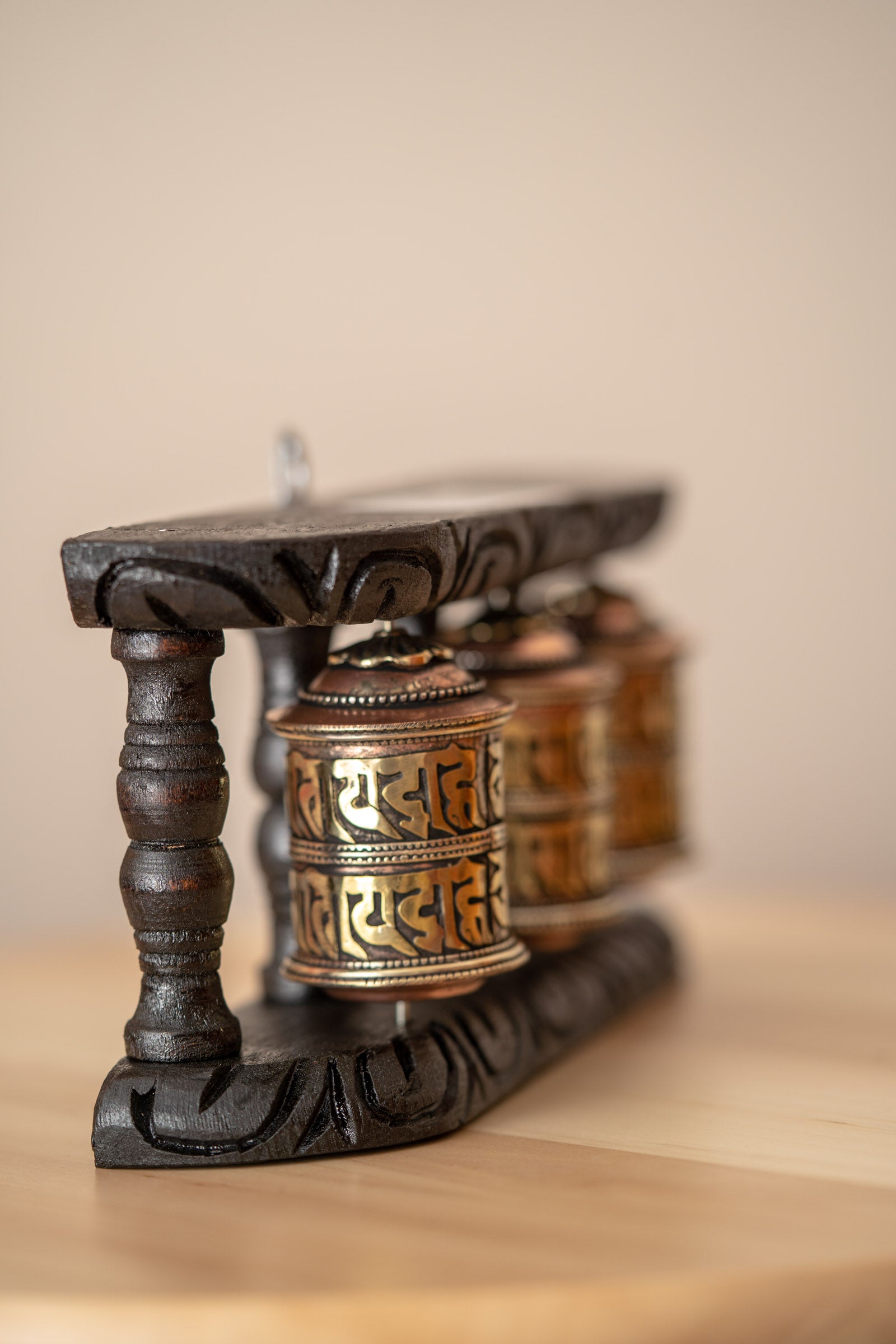 Wood Stand Prayer Wheel for home decor and spirituality.