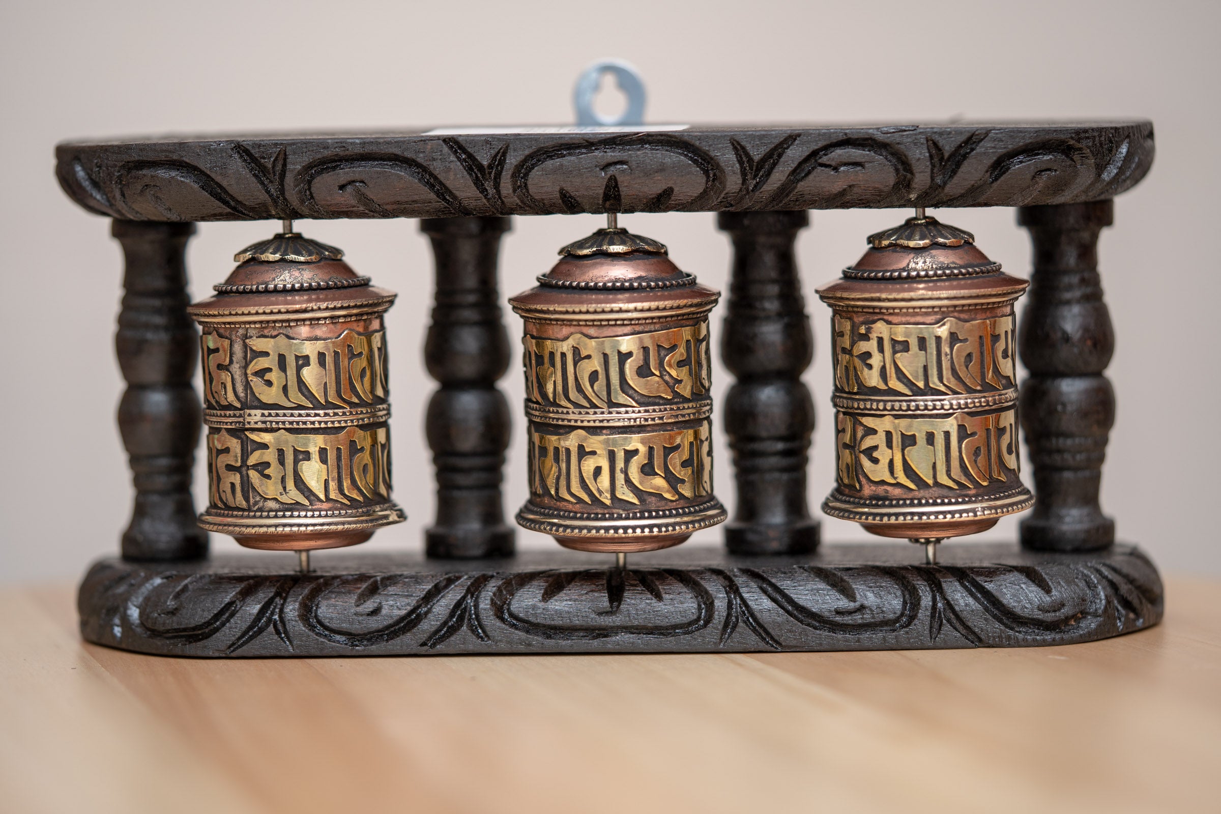 Wood Stand Prayer Wheel for home decor and spirituality.