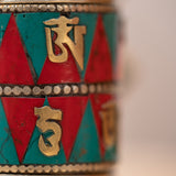 Prayer wheel with endless knot symbol for spiritual practice .