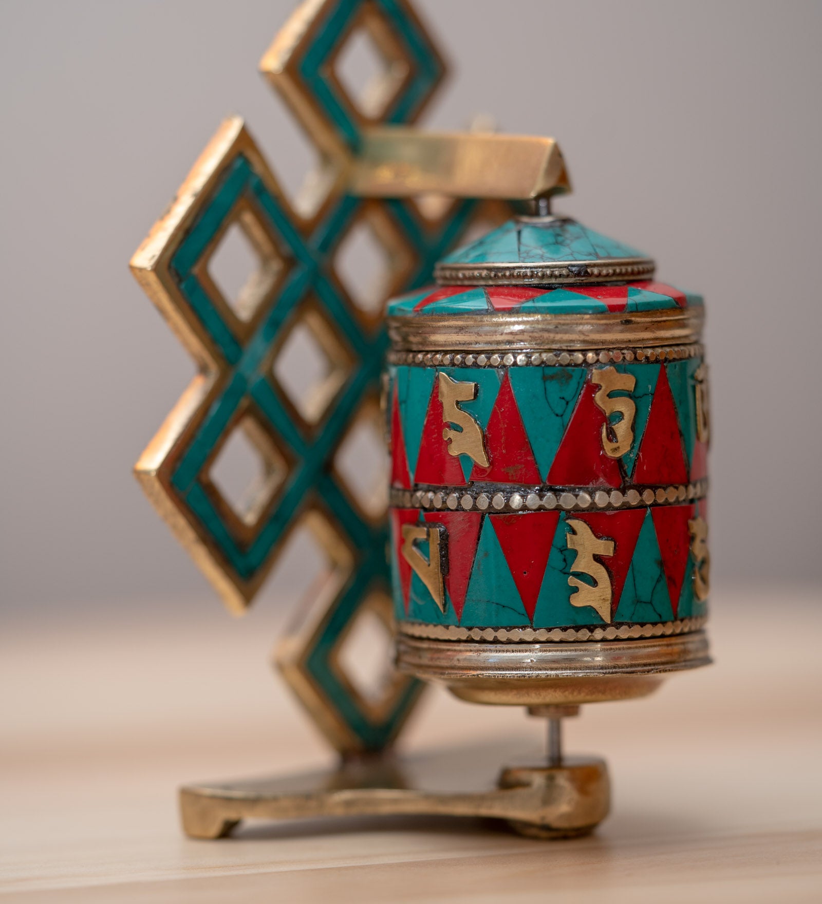 Prayer wheel with endless knot symbol for spiritual practice .