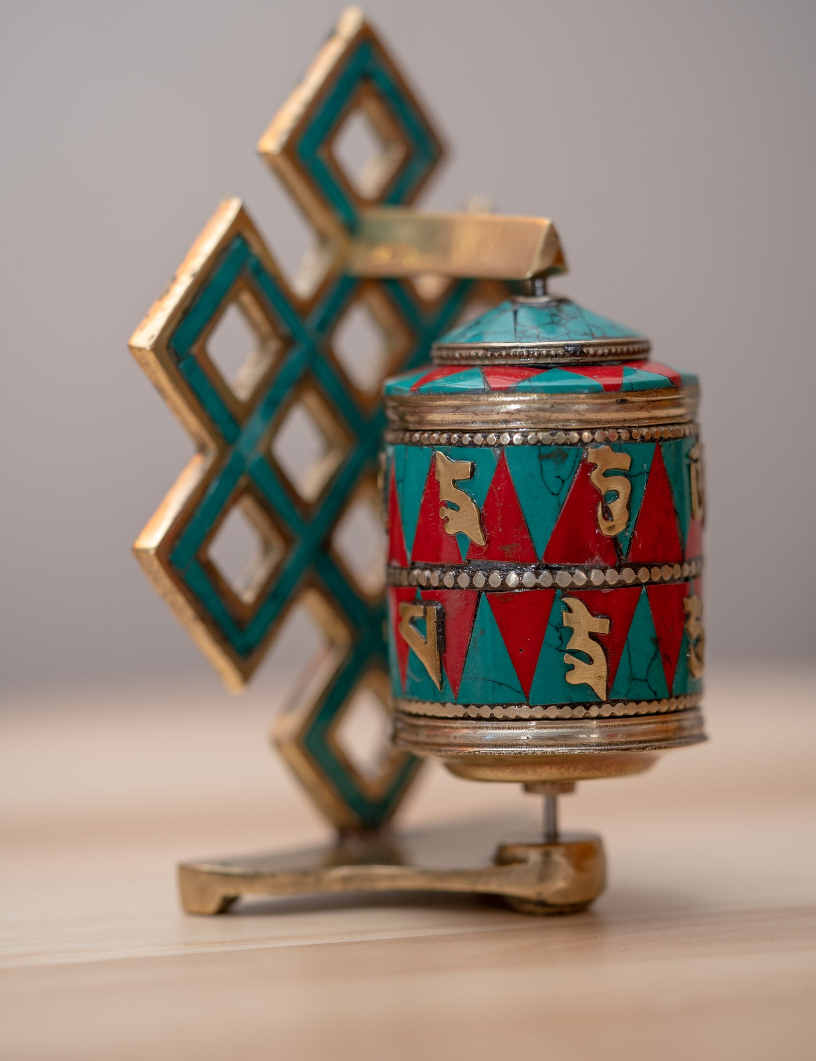 Prayer wheel with endless knot symbol for spiritual practice .