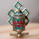 Prayer wheel with endless knot symbol for spiritual practice .