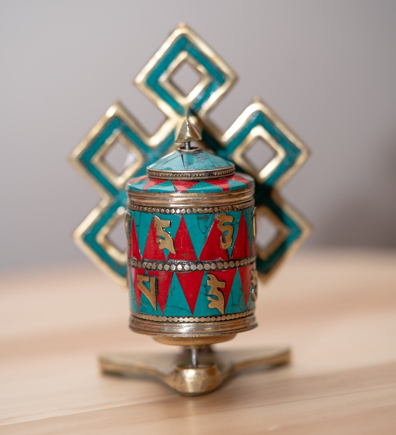 Prayer wheel with endless knot symbol for spiritual practice .