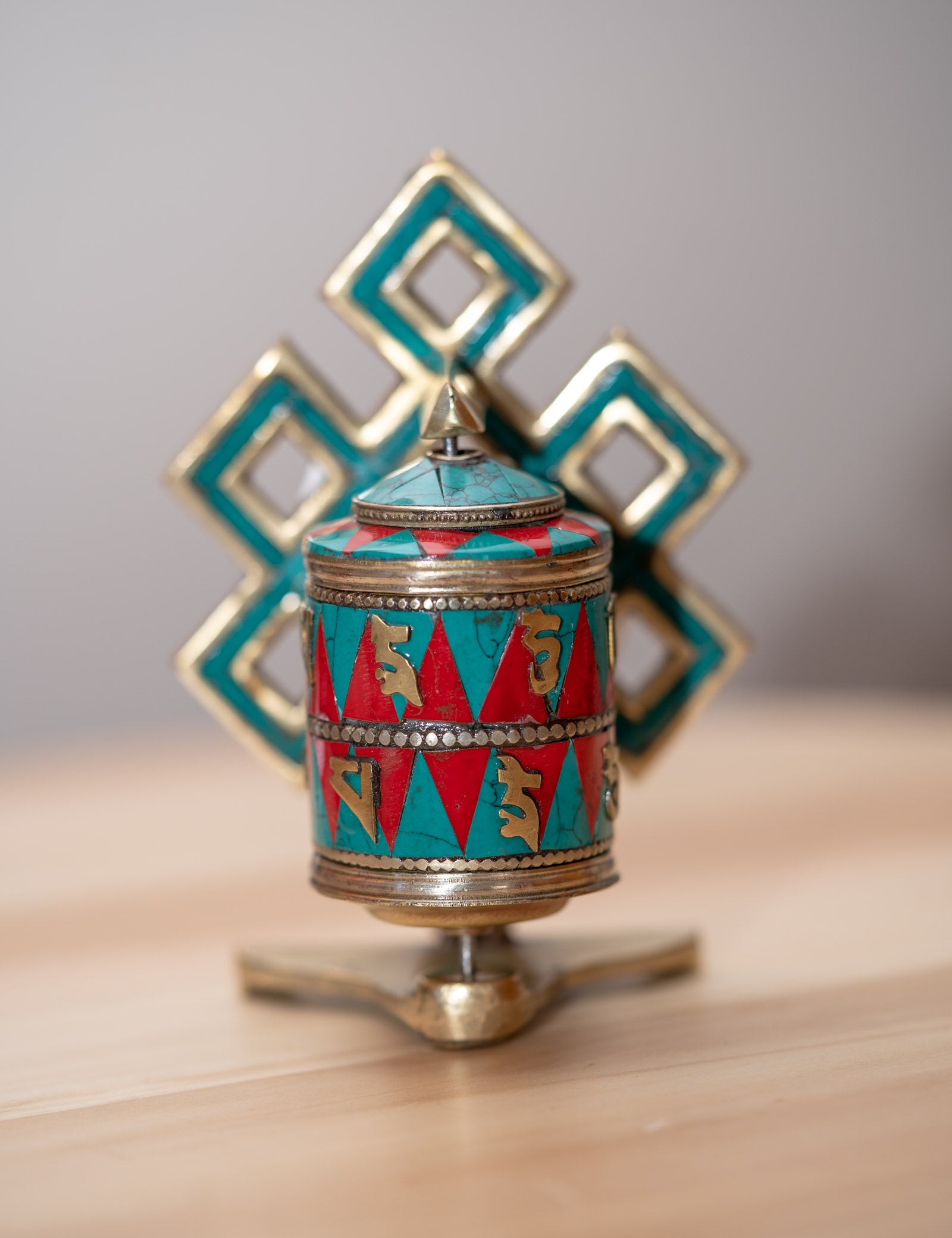 Prayer wheel with endless knot symbol for spiritual practice .