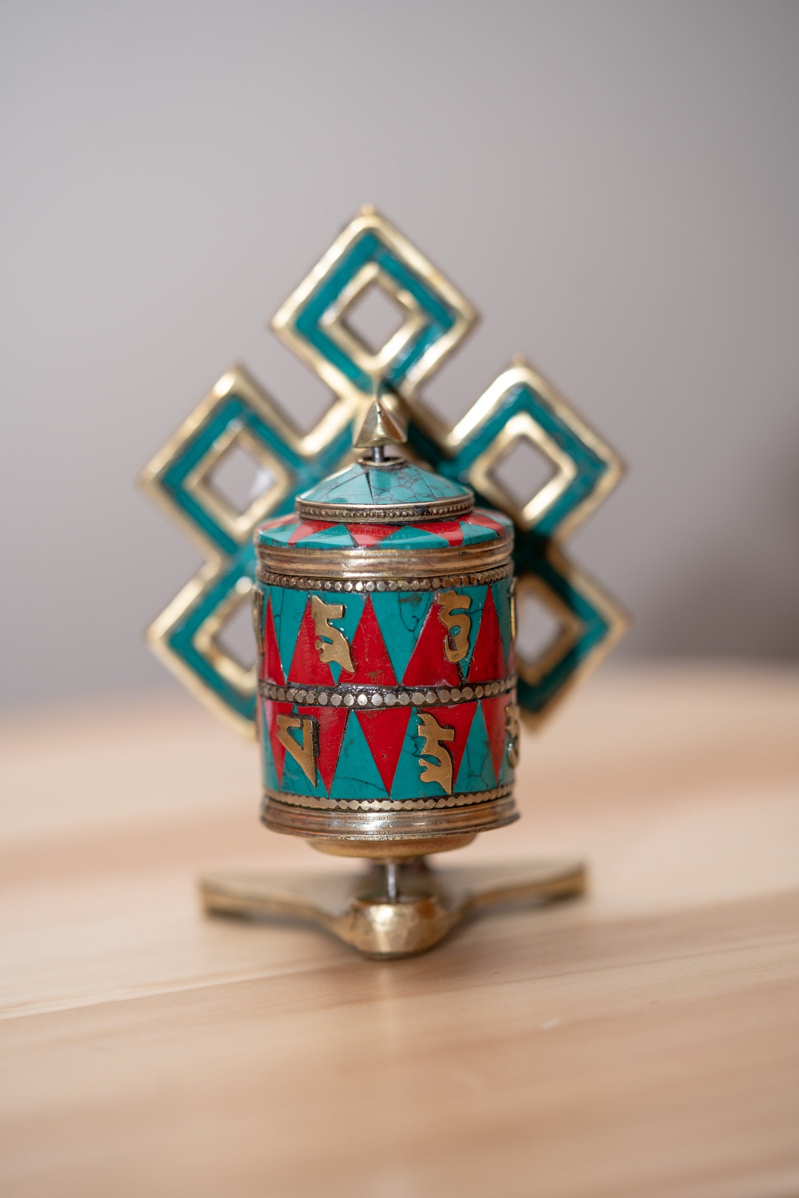 Prayer wheel with endless knot symbol for spiritual practice .