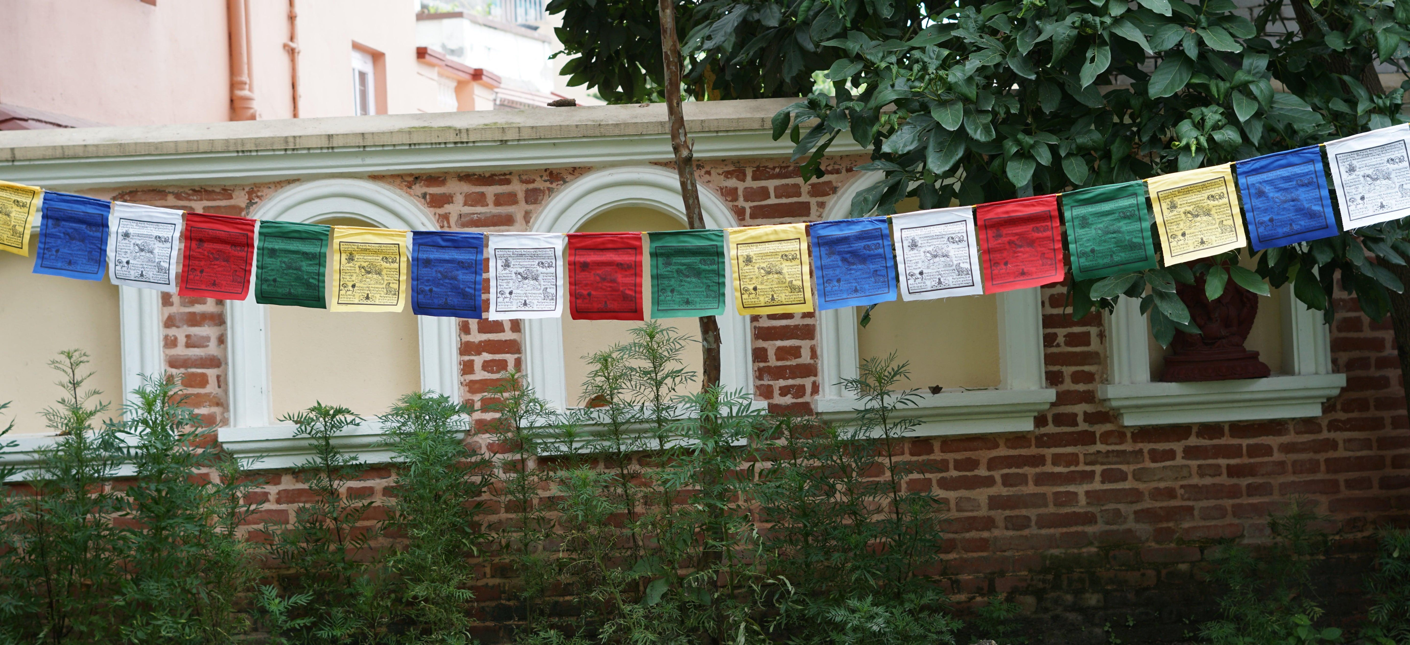 Wind horse prayer flag being hung