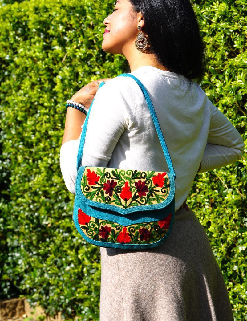 Beautiful handmade women's crossbody bag with floral embroidery design for chic boho style. 