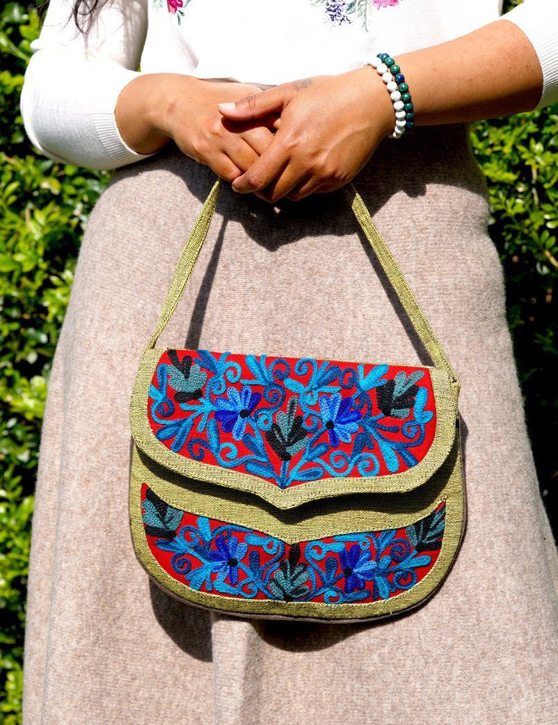 Beautiful hand embroidered crossbody bag with bright and multi-colour embroidered floral patterns.