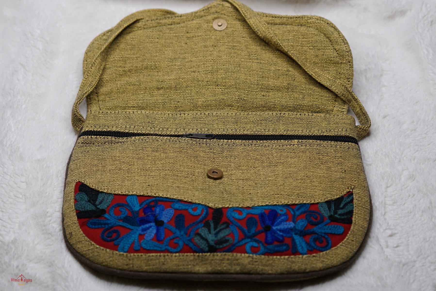 Beautiful hand embroidered crossbody bag with bright and multi-colour embroidered floral patterns.