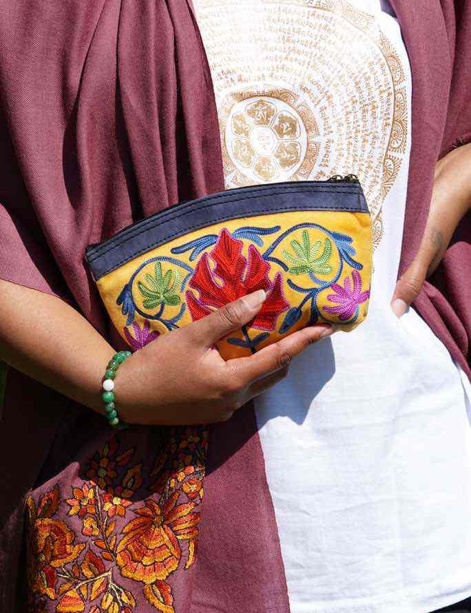 A special women pouch very light weight, ideal as a makeup bag or everyday use hand purse.