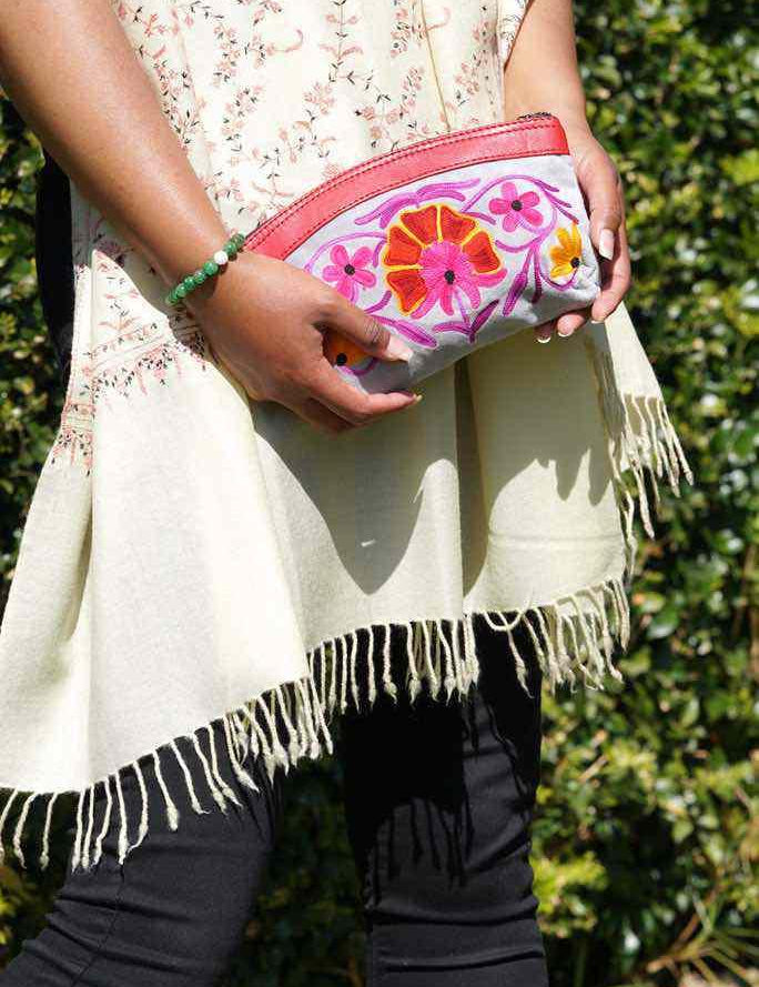 Women pouch purse with floral pattern, ultra-soft and lightweight. The pouch can be used as makeup bag or clutch that suit your style. Ethically made in Nepal.