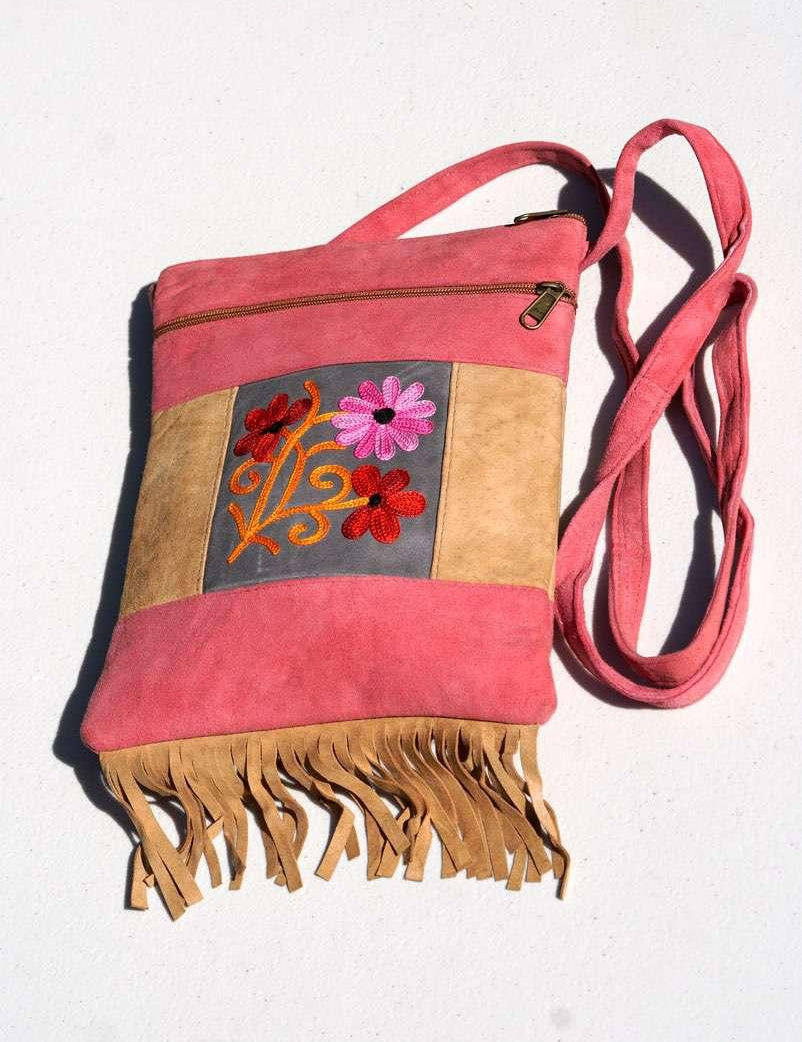 Easy to carry side bag for women, features a beautiful hand embroidered floral pattern. 