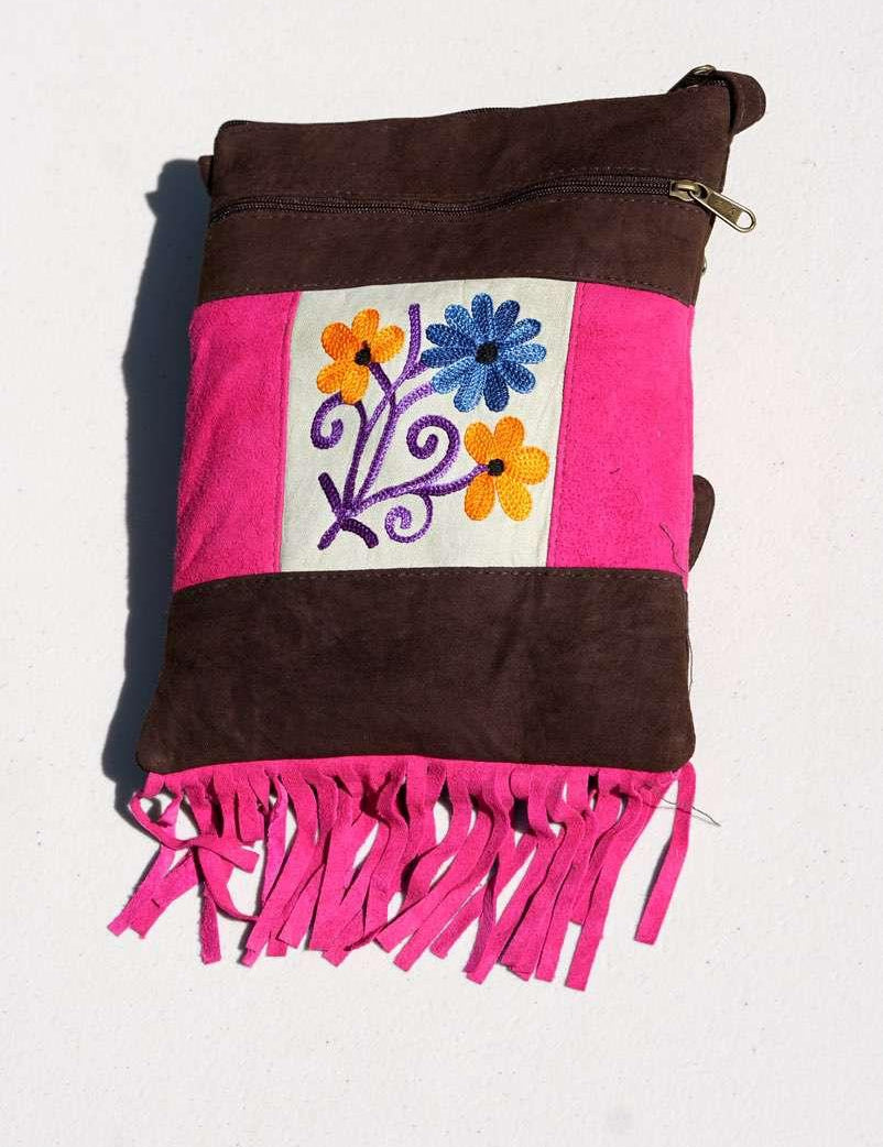 Easy to carry side bag for women, features a beautiful hand embroidered floral pattern. 