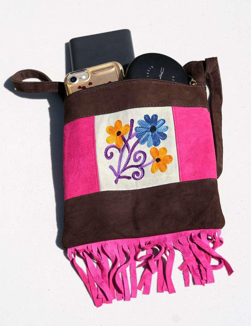 Easy to carry side bag for women, features a beautiful hand embroidered floral pattern. 