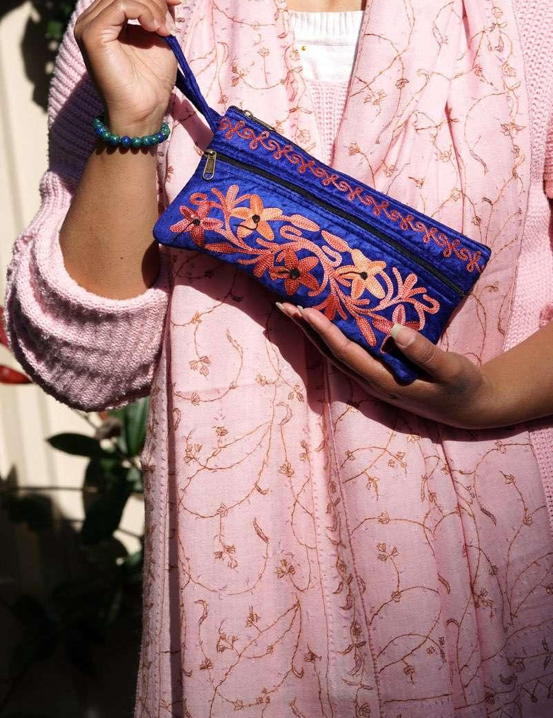 A unique style women's wristlet wallet with floral pattern, crafted ethically from Himalayas.