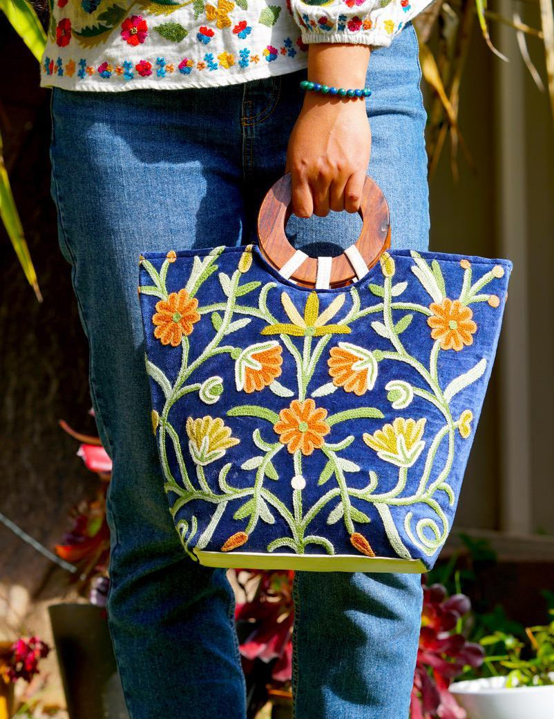 A classic women's tote bag, crafted with beautiful cashmere floral embroidery to give it a chic stylish look.