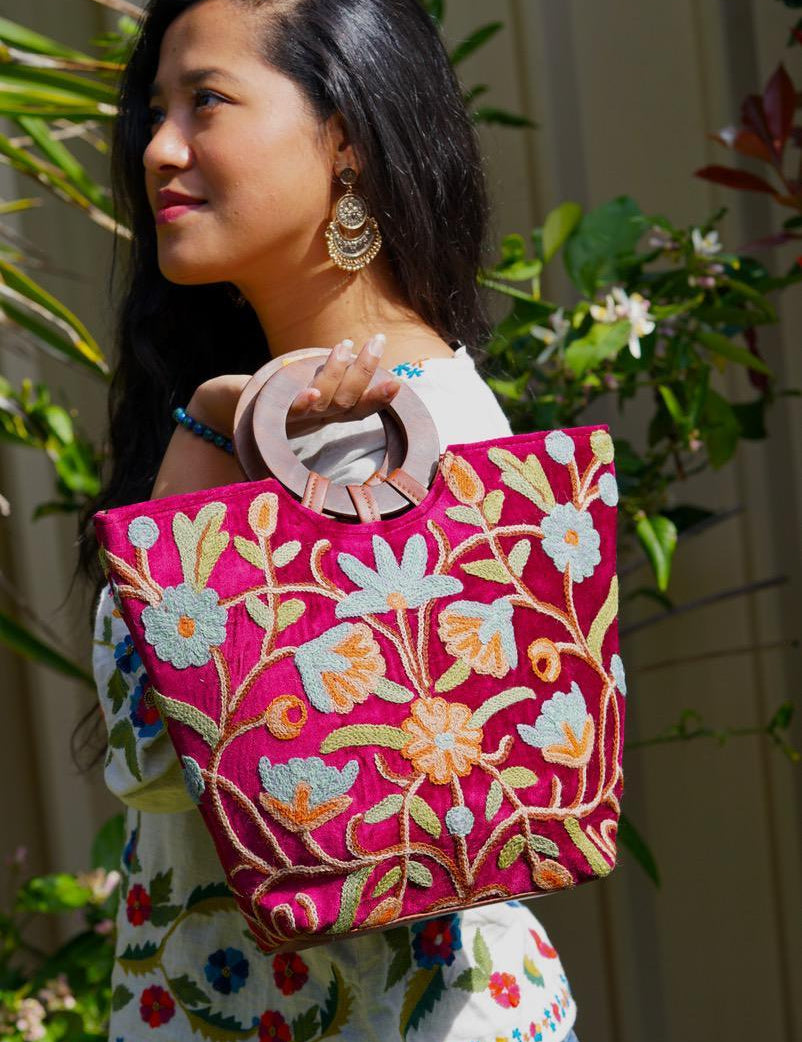 A classic women's tote bag, crafted with beautiful cashmere floral embroidery to give it a chic stylish look.