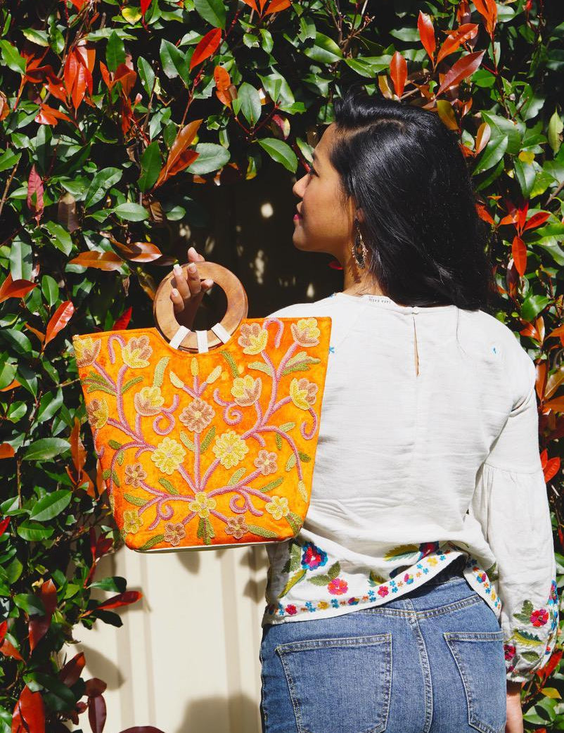 A stylish women's tote bag with floral pattern, crafted ethically from Himalayas.