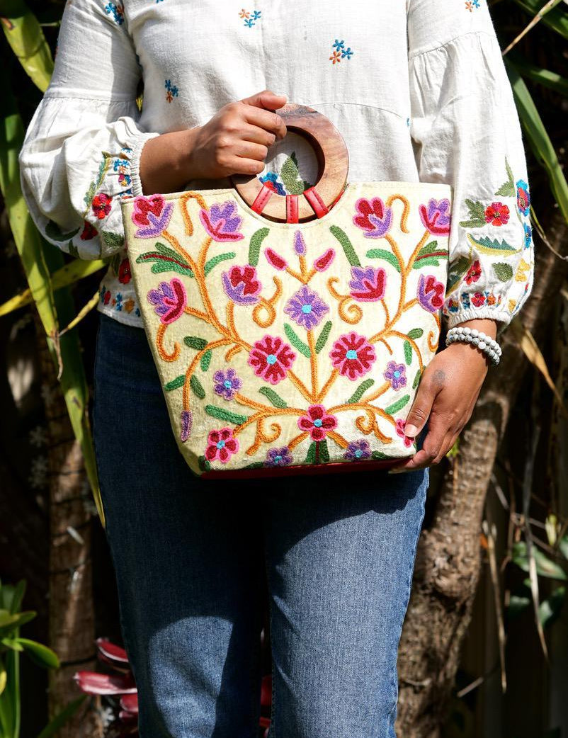 A stylish women's tote bag with floral pattern, crafted ethically from Himalayas.