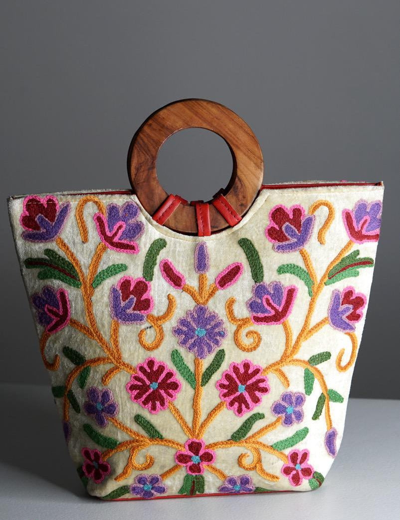 A stylish women's tote bag with floral pattern, crafted ethically from Himalayas.