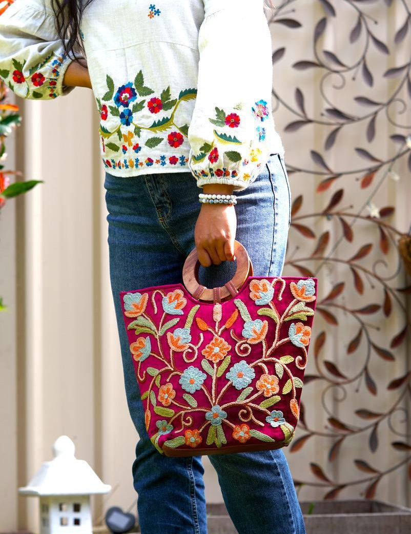 Beautiful hand embroidered tote bag with bright and multi-colour embroidered floral patterns.