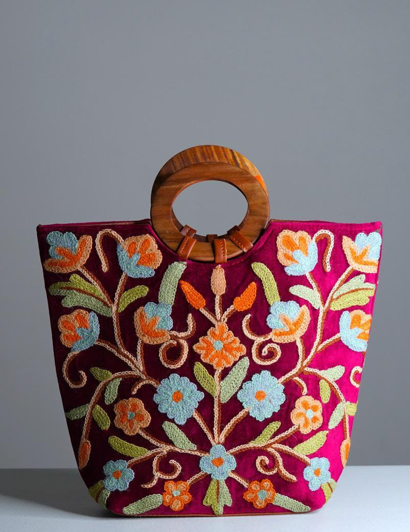 Beautiful hand embroidered tote bag with bright and multi-colour embroidered floral patterns.